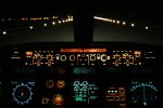 aircraft landing at night with runway ahead